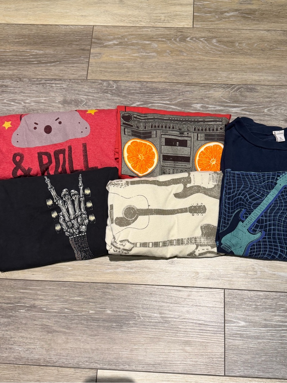 Bundle of youth Fender or music themed shirts